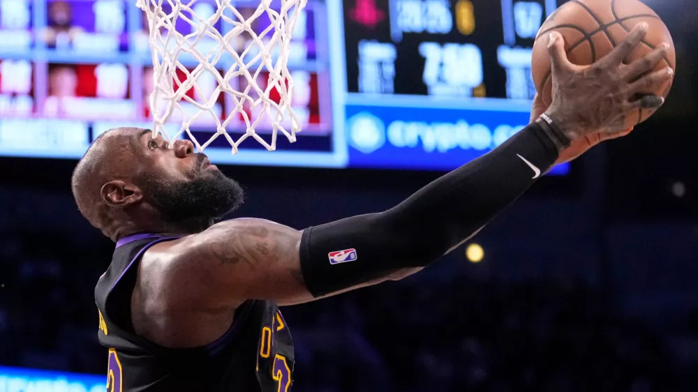 Los Angeles Lakers forward LeBron James shoots during the second half in Game 2 of a first-round NBA playoffs basketball series against the Houston Rockets, Tuesday, April 21, 2026, in Los Angeles. (AP Photo/Mark J. Terrill)