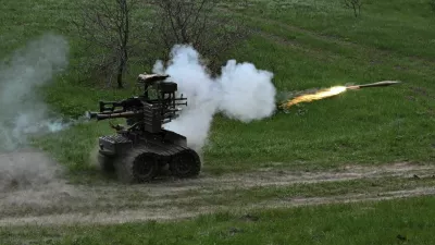 Ukrainian servicemen fire an RPG-7 grenade launcher mounted on an unmanned ground vehicle during testing at a training ground near a front line, amid Russia's attack on Ukraine, in Zaporizhzhia region, Ukraine April 10, 2026. REUTERS/Stringer