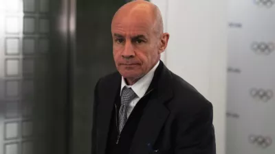 FILE - Candidate to the presidency of the International Olympic Committee Johan Eliasch arrives at the mixed zone during a break of the 144th session, which will elect the new IOC President, in Costa Navarino, western Greece, March 19, 2025. (AP Photo/Thanassis Stavrakis, File)