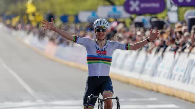 Slovenia's Tadej Pogacar crosses the finish line to win the Tour of Flanders cycling race, in Oudenaarde, Belgium Sunday, April 5, 2026. (AP Photo/Geert Vanden Wijngaert)