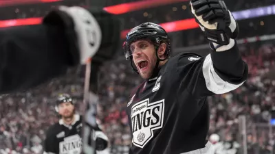 Los Angeles Kings' Anze Kopitar (11) celebrates a goal by Joel Edmundson against the Colorado Avalanche during the second period of Game 4 in the first round of an NHL hockey Stanley Cup playoff series Sunday, April 26, 2026, in Los Angeles. (AP Photo/Scott Strazzante)