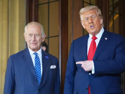 FILE - President Donald Trump gestures next to Britain's King Charles III before leaving Windsor Castle, Windsor, England, Sept. 18, 2025. (AP Photo/Evan Vucci, file)