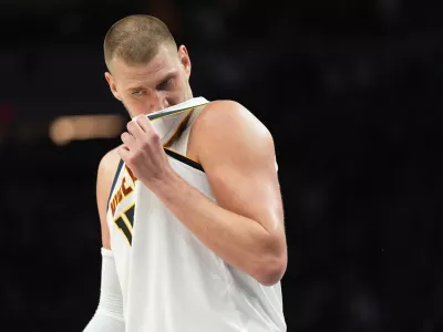 Denver Nuggets center Nikola Jokic (15) waits for play to resume during the second half in Game 3 of a first-round NBA basketball playoff series against the Minnesota Timberwolves, Thursday, April 23, 2026, in Minneapolis. (AP Photo/Abbie Parr)
