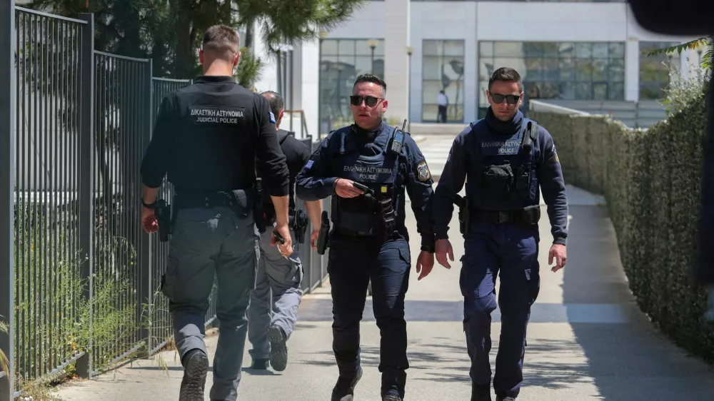 Police officers walk outside the Athens' Court of Appeal following a shooting incident that left several wounded, in Athens, Greece, April 28, 2026. Sotiris Dimitropoulos/Eurokinissi via REUTERS THIS IMAGE HAS BEEN PROVIDED BY A THIRD PARTY. NO RESALES. NO ARCHIVES. MANDATORY CREDIT. GREECE OUT. NO COMMERCIAL OR EDITORIAL SALES IN GREECE.