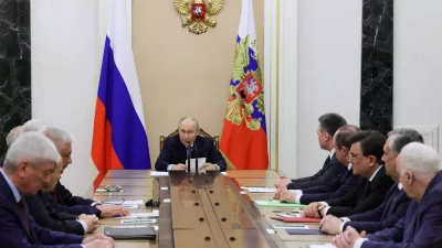 Russian President Vladimir Putin, center, speaks at the Kremlin in Moscow, Tuesday, April 28, 2026, during a meeting on providing security for the upcoming Russian Parliamentary elections. (Mikhail Metzel/Sputnik, Kremlin Pool Photo via AP)
