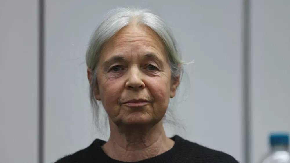Daniela Klette, accused of being one of the last surviving members of the Red Army Faction group, who was arrested after decades on the run for armed robbery and attempted murder, reacts on the day of her trial at a regional court in Celle, Germany March 25, 2025. REUTERS/Wolfgang Rattay