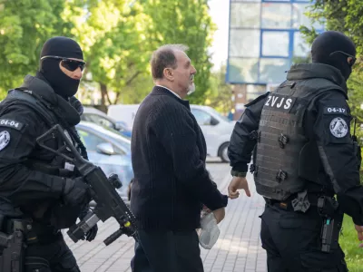 Juraj Cintula, who is facing charges of committing a serious crime of terrorist attack on Premier Robert Fico, arrives at the Supreme Court in Bratislava, Slovakia, Wednesday April, 29, 2026. (Martin Baumann/TASR via AP)