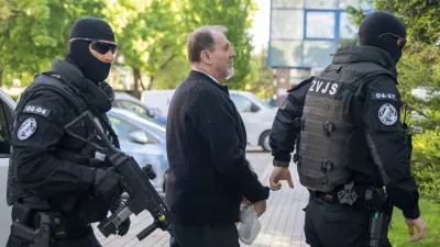 Juraj Cintula, who is facing charges of committing a serious crime of terrorist attack on Premier Robert Fico, arrives at the Supreme Court in Bratislava, Slovakia, Wednesday April, 29, 2026. (Martin Baumann/TASR via AP)