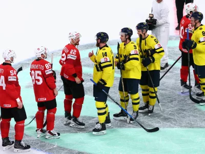 Ice Hockey - IIHF World Championships - Quarter Final - Switzerland v Sweden - Swiss Life Arena, Zurich, Switzerland - May 28, 2026 Switzerland's Nino Niederreiter speaks with Sweden's Mattias Ekholm after the match REUTERS/Denis Balibouse