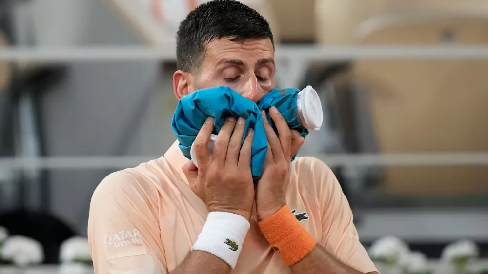 Novak Djokovic of Serbia reacts after the third round men's singles tennis match against Joao Fonseca of Brazil at the French Open tennis tournament in Paris, Friday, May 29, 2026. (AP Photo/Christophe Ena)