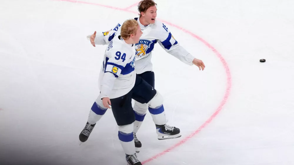 Ice Hockey - IIHF World Championships - Gold Medal Game - Switzerland v Finland - Swiss Life Arena, Zurich, Switzerland - May 31, 2026 Finland's Konsta Helenius celebrates scoring their first goal in overtime with Anton Lundell REUTERS/Denis Balibouse