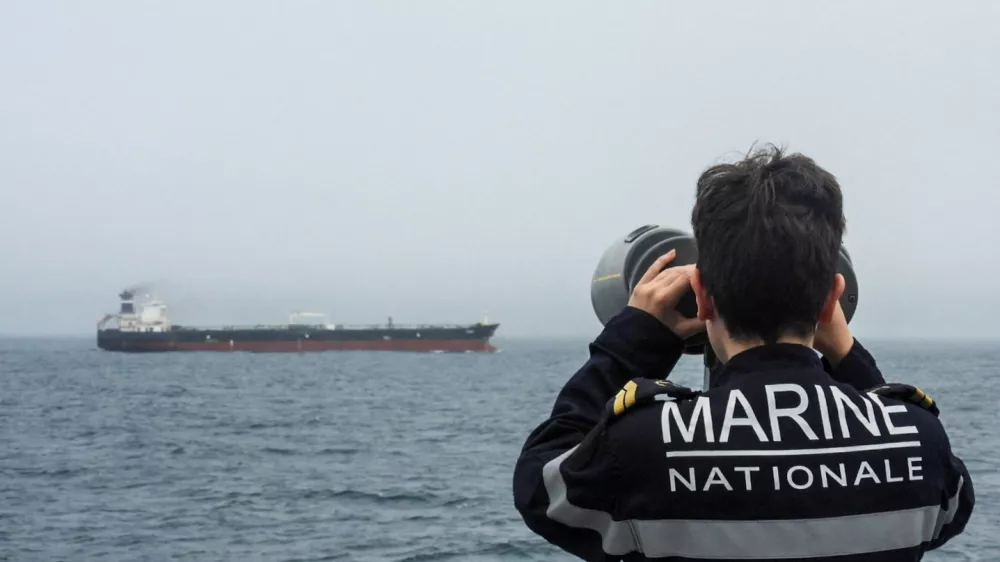A French Navy personnel observes an oil tanker, subject to international sanctions and sailing from Russia, sailing in the Atlantic Ocean, in this handout obtained by Reuters on June 1, 2026. Marine Nationale/Handout via REUTERS  THIS IMAGE HAS BEEN SUPPLIED BY A THIRD PARTY. NO RESALES. NO ARCHIVES