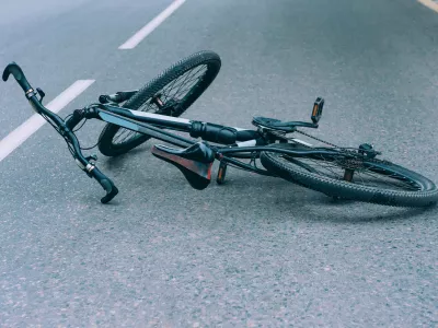 Bicycle lies on the pavement on the roadway. Concept on the theme of the accident