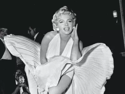 Designer William Travilla created The Seven Year Itch's white dress and he dreamed up the pink and gold gowns from Gentlemen Prefer Blondes &ndash; all famous Monroe getups. Although the designer never paid much heed to his creation (once dismissing it as "that silly little dress") it has paid off, and was sold at a 2011 auction for .6m. The auction resulted from Debbie Reynolds' need to sell off assets to avoid bankruptcy. Those assets included her collection of Old Hollywood memorabilia (that she hoped to eventually house in a museum of her own), among which was Monroe's dress &ndash; which Reynolds said she only paid 0 for in 1971 - Anne T Donahue,Image: 580025776, License: Royalty-free, Restrictions:, Model Release: no