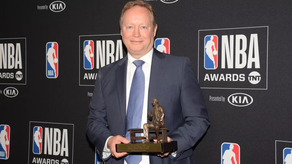 June 24, 2019; Los Angeles, CA, USA; Milwaukee Bucks head coach Mike Budenholzer poses with his coach of the year award at the 2019 NBA Awards show at Barker Hanger. Mandatory Credit: Gary A. Vasquez-USA TODAY Sports