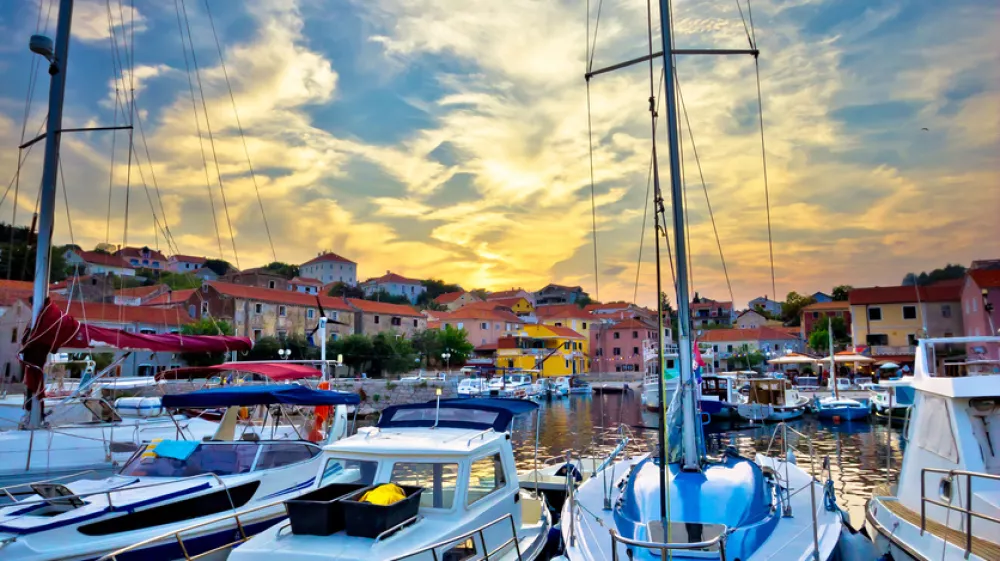 Sali village sunset in harbor vertical view, island of Dugi otok in Croatia