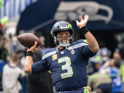 FILE - Seattle Seahawks quarterback Russell Wilson passes the ball during warmups before an NFL football game against the Arizona Cardinals, Nov. 21, 2021, in Seattle. (AP Photo/Stephen Brashear, File)