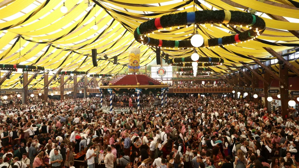 People visit Paulaner tent on the day of the official opening of the 190th Oktoberfest, the world's largest beer festival in Munich, Germany, September 20, 2025. REUTERS/Maryam Majd