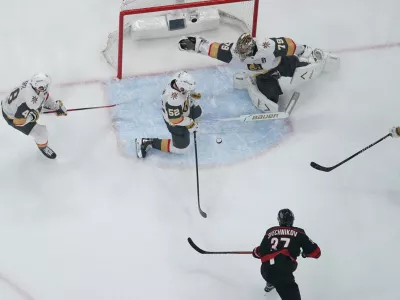 Jun 4, 2026; Raleigh, North Carolina, USA; Vegas Golden Knights goaltender Carter Hart (79) and defenseman Dylan Coghlan (52) defend against Carolina Hurricanes right wing Andrei Svechnikov (37) during the first period in game two of the 2026 Stanley Cup Final at Lenovo Center. Mandatory Credit: James Guillory-Imagn Images