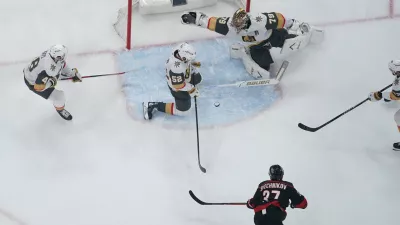 Jun 4, 2026; Raleigh, North Carolina, USA; Vegas Golden Knights goaltender Carter Hart (79) and defenseman Dylan Coghlan (52) defend against Carolina Hurricanes right wing Andrei Svechnikov (37) during the first period in game two of the 2026 Stanley Cup Final at Lenovo Center. Mandatory Credit: James Guillory-Imagn Images