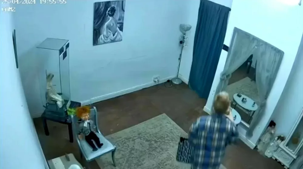 Story from Jam Press (Most Haunted Doll)Pictured: Video Grab: An unidentified object caught on camera.'I own Britain's most haunted doll &ndash; people flee the room in tears when she scratches them and pulls their hair'Visitors claim they were scratched and had their hair pulled after gathering to see a doll dubbed Britain's "most haunted".Elizabeth, a porcelain bridal doll, has already built a notorious reputation online after years of alleged paranormal incidents.But now the doll's owner, Lee Steer, says a new wave of strange encounters during two public open days has left even sceptics unsettled.The 40-year-old, who owns the Haunted Objects Museum in Rotherham, South Yorks, where the doll is kept, claims dozens of people in recent months have reported unusual experiences."Quite a few people have refused to be in the same room as Elizabeth during public museum events, especially at night," Lee, from Rotherham, South Yorks, told creatorzine.com."Some visitors feel uncomfortable almost immediately and choose to leave rather than stay near her."The incidents were spread across both days, but there did seem to be a period where activity became noticeably more concentrated, around 2pm seemed to be when the most reports started coming in."On the first day, there were cold drafts, temperature changes being picked up on the paranormal equipment, movement involving a pram, and two separate visitors claiming their hair had been pulled."On the second day, the bell-trigger equipment appeared much more active and responsive."We also had a visitor report their hair bobble being tugged, and another person noticed their bag had opened unexpectedly while near the doll."There were visitors who became overwhelmed enough to leave the room, and in some cases even step outside the building entirely to calm themselves down before returning."Once other guests started sharing their own experiences, the atmosphere naturally became much more intense, and for some people that clearly heightened the fear factor."Elizabeth, believed to be a Franklin Mint Gibson Girl bridal collector doll dating from the late 1980s, first hit headlines years ago after previous owner Debbie Merrick claimed disturbing incidents began happening in her home.According to Lee, the doll had originally been discovered in a skip before ending up in an antiques shop, where Debbie later bought it.She allegedly experienced unexplained fire alarms, moved objects and mysterious scratches before eventually listing the doll on eBay simply as a "creepy doll".Lee purchased Elizabeth for Ł866 after stumbling across the auction.He said: "For reasons I still can't fully explain, I felt drawn to the doll and decided to bid, without fully realising I was bidding on a doll that was already attracting serious press interest."Over the years, more than 30 individuals have claimed unusual experiences after being around the doll, including unexplained scratches, burns, emotional distress, strange dreams, and other unsettling incidents."Since then, Elizabeth has become one of Britain's best-known allegedly haunted objects.But Lee says the most recent incidents have been among the strangest yet.During special daytime opening events at the museum, visitors travelled from across the UK specifically to spend time near the doll.Several people reported phones freezing, restarting or refusing to record near the doll.Lee said: "Since I bought Elizabeth, lights flicker, objects move, items are knocked over, and strange disturbances happening when there's no obvious explanation."What's always stood out to me is that it often seems to happen when something new is introduced into the museum, almost like a jealous reaction."Whether that's paranormal or something else, those moments are definitely the creepiest to witness firsthand."One particularly unsettling moment involved a child's pram which visitors claimed appeared to move on its own.Another example, he claims, involved perfume bottles being "thrown across a room with force" rather than simply falling over accidentally.According to Lee, a man who had spent time around Elizabeth later collapsed during a Ouija board session in another part of the building.Lee insists he remains sceptical despite years spent investigating the doll.He said: "I think scepticism is healthy."In some cases there may well be logical explanations such as accidental scratches, environmental factors, or people simply not noticing when something happened."What makes it interesting to me is when similar reports keep coming from different people, often independently of each other."I'm not here to force a paranormal explanation on anyone, but after seeing the number of repeated claims over the years, I do think it's worth documenting and investigating rather than dismissing outright."I fully understand that in today's world, with social media, editing, and AI, people question everything and rightly so."But for me, what matters most is what I've personally seen and experienced in real life that I genuinely can't explain through normal means."Following the latest incidents, Lee says stricter rules may soon be introduced for guests entering Elizabeth's room, including requests not to provoke or mock the doll.Visitors are forbidden from touching Elizabeth.Despite the doll's sinister reputation, Lee says he has no plans to get rid of her, despite believing she could be dangerous.Lee said: "If ghosts or paranormal energy are genuinely real, then Elizabeth could potentially be dangerous simply because of the type of incidents people have associated with her over the years."It's not just scratches, it's the larger disturbances that make you think."There was even an incident at a London train station where the departure boards went down while travelling with her."That could absolutely be coincidence or bad timing, and I'm honest about that."But when you start seeing enough strange incidents stack up around one object, you naturally begin asking bigger questions."Whatever is happening around Elizabeth, whether paranormal or something else, I'm interested in understanding it rather than getting rid of her."ENDSEDITOR'S NOTE: Video Usage Licence: (EXCLUSIVE) We have obtained an exclusive licence from the copyright holder. A copy of the licence is available on request.Video Restrictions: None.,Image: 1106387504, License: Rights-managed, Restrictions: EDITOR'S NOTE: Video Usage Licence: (EXCLUSIVE) We have obtained an exclusive licence from the copyright holder. A copy of the licence is available on request.Video Restrictions: None., Model Release: no 