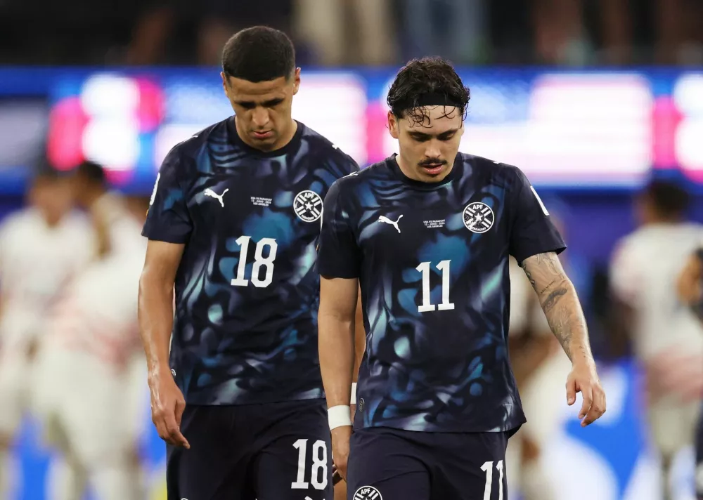 Soccer Football - FIFA World Cup 2026 - Group D - United States v Paraguay - Los Angeles Stadium, Inglewood, California, U.S. - June 12, 2026 Paraguay's Alex Arce and Mauricio look dejected after Giovanni Reyna of the U.S. scores their fourth goal IMAGN IMAGES via Reuters/Kiyoshi Mio
