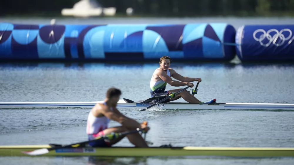Isak Ivan Zvegelj, of Slovenia, competes in men's single scull rowing repechage at the 2024 Summer Olympics, Sunday, July 28, 2024, in Vaires-sur-Marne, France. (AP Photo/Ebrahim Noroozi)