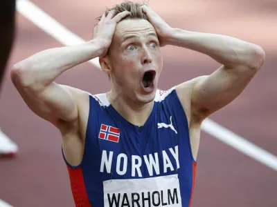 Tokyo 2020 Olympics - Athletics - Men's 400m Hurdles - Final - Olympic Stadium, Tokyo, Japan - August 3, 2021. Karsten Warholm of Norway reacts after realizing he had set a new world record. REUTERS/Phil Noble
