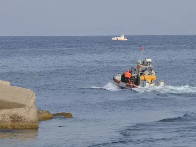 Italian Firefighters scubadivers sails towards the area where the UK flag vessel Bayesan that was hit by a violent sudden storm, sunk early Monday, Aug. 19, 2024, while at anchor off the Sicilian village of Porticello near Palermo, in southern Italy. (AP Photo/Lucio Ganci)