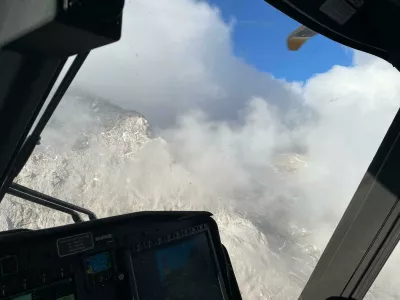 Re&scaron;evanje dveh pohodnikov s Triglava.