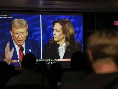 Dr. Christopher Terry's students watch the debate between Republican presidential nominee former President Donald Trump and Democratic presidential nominee Vice President Kamala Harris during a campus watch party at the University of Minnesota's Murphy Hall on Tuesday, Sept. 10, 2024, in Minneapolis. (Kerem Y&uuml;cel/Minnesota Public Radio via AP)