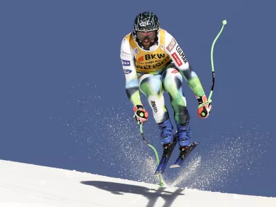 Slovenia's Bostjan Kline speeds down the course during an alpine ski, men's World Cup downhill race, in Wengen, Switzerland, Friday, Jan. 14, 2022. (AP Photo/Gabriele Facciotti)